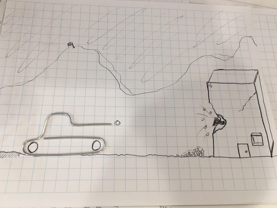 peisaj construit dintr-o agrafa de hartie modelata in forma de tanc si desenul cu creionul al unei cladiri care e bombardata pe o foaie de matematica